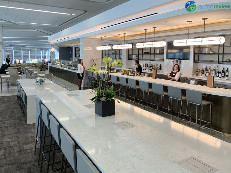 Communal work tables at the new United Club LaGuardia