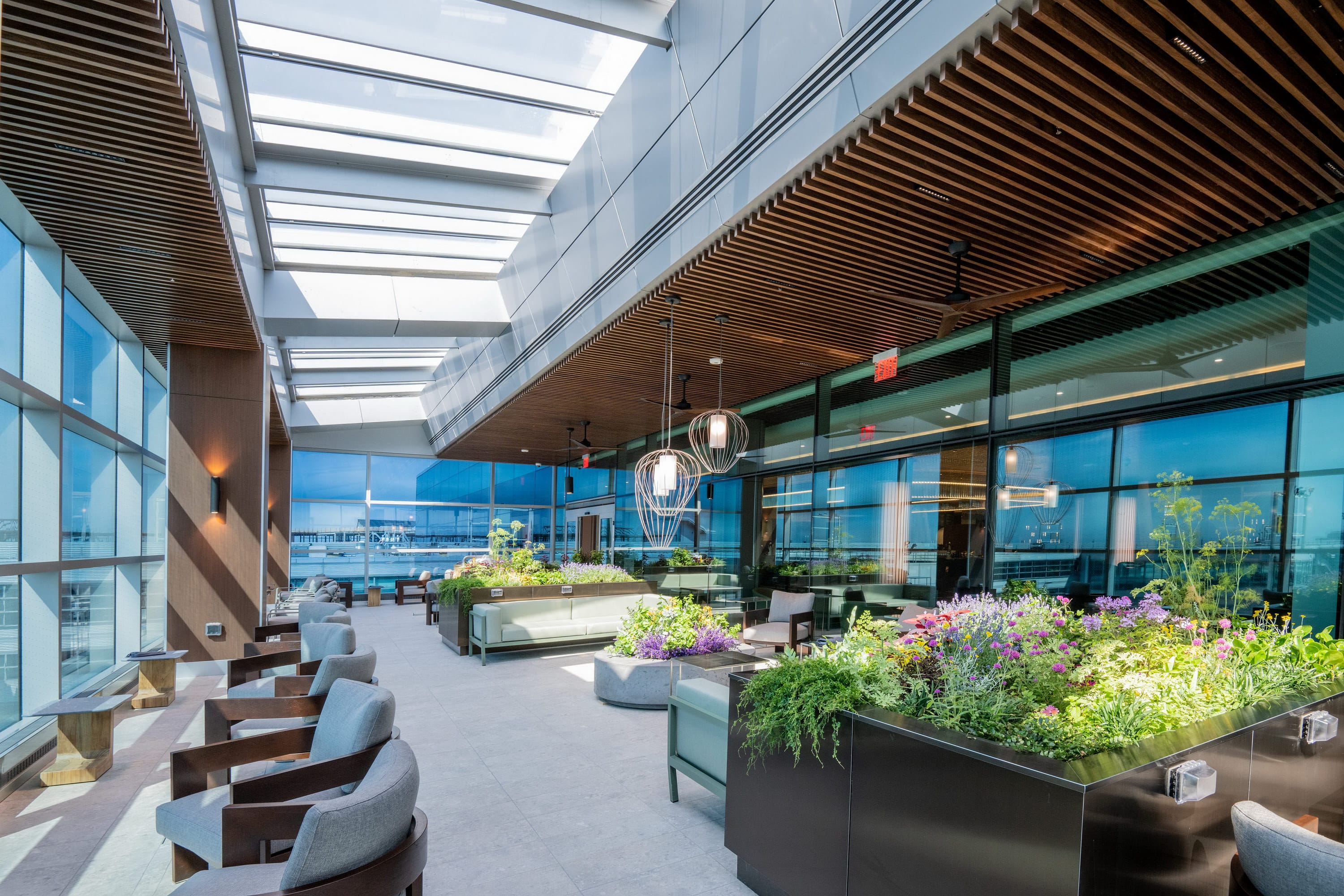 The beautiful year-round open-air terrace at the Delta One Lounge JFK is a pleasant space to work or relax.